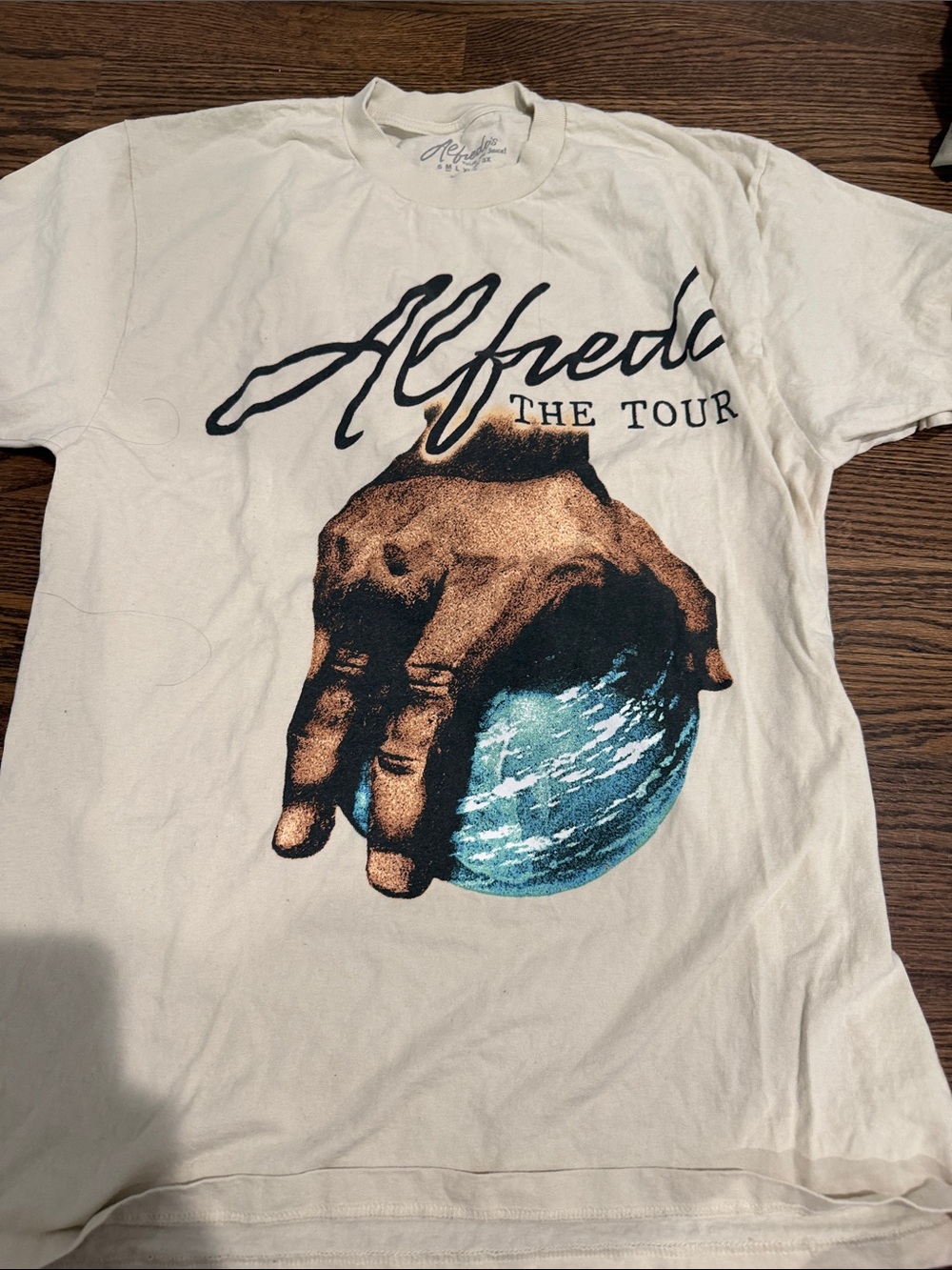 Alfredo The Tour Graphic Tee - Cream with Blue & Brown Globe
